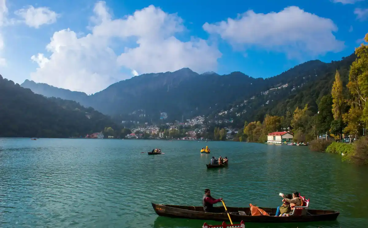 Beautiful Naini Lake in Nainital with colorful boats and surrounding hills