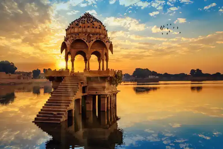 A serene boat ride on Lake Pichola with the City Palace of Udaipur in the background